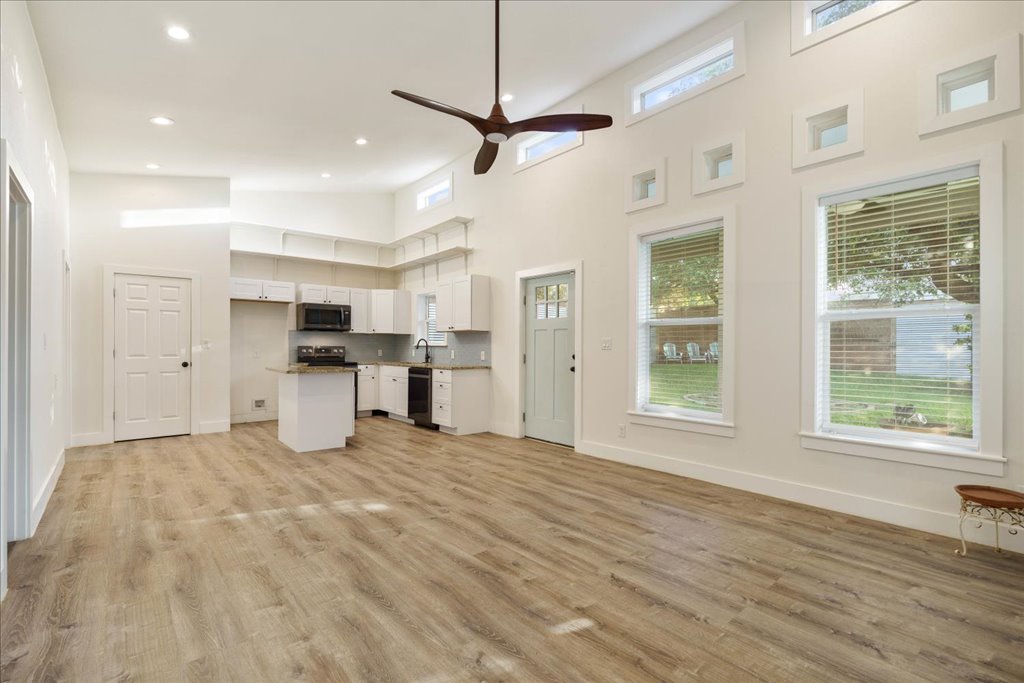 10213 Thomas Lane Dripping Springs, TX 78620 - Photo 37 of 40 a view of kitchen with stainless steel appliances refrigerator oven microwave and stove