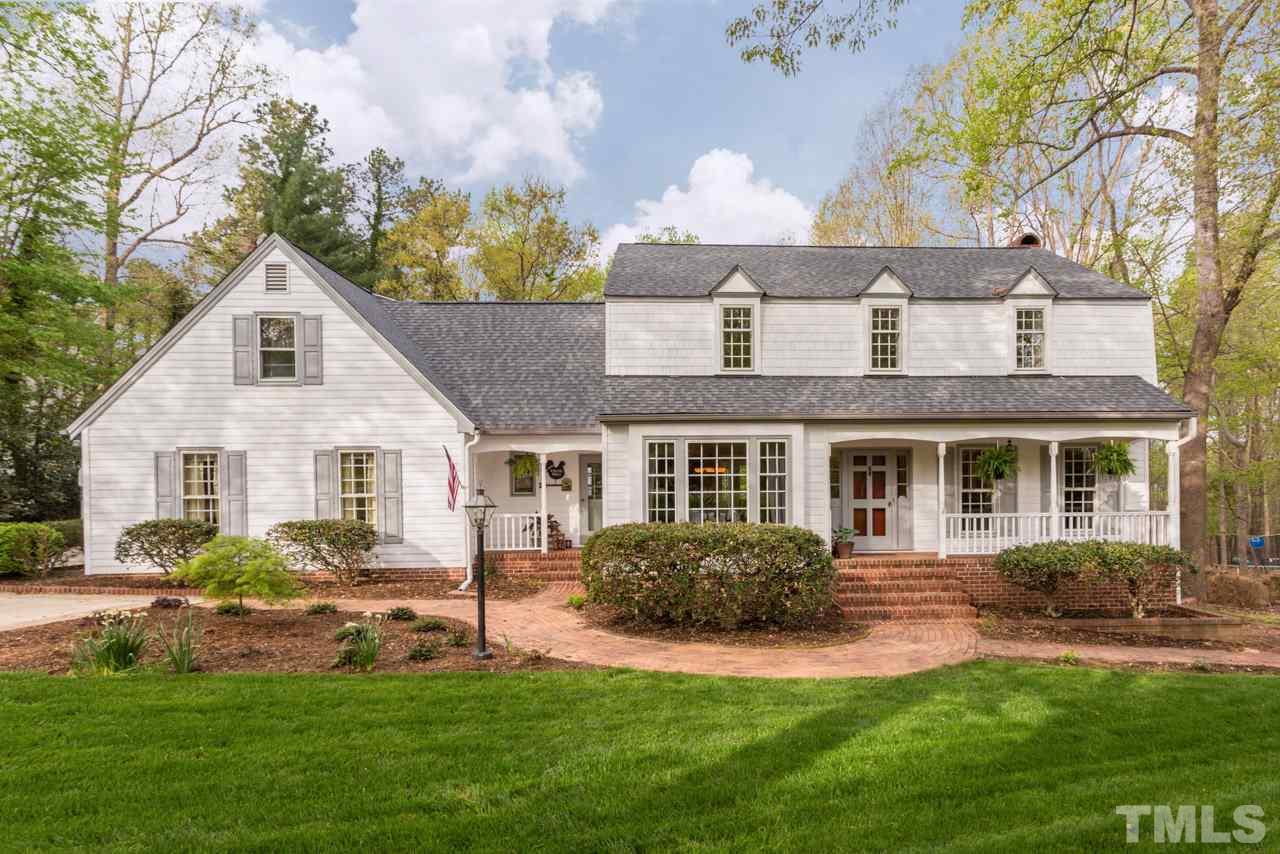 905 Brookfield Road Raleigh, NC 27615 - Photo 1 of 25 a front view of a house with a yard and potted plants