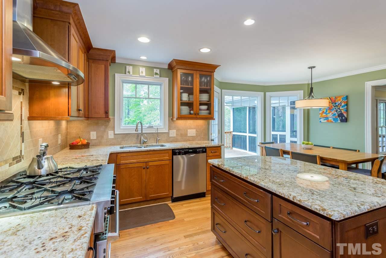905 Brookfield Road Raleigh, NC 27615 - Photo 2 of 25 a kitchen with stainless steel appliances granite countertop a sink stove and cabinets
