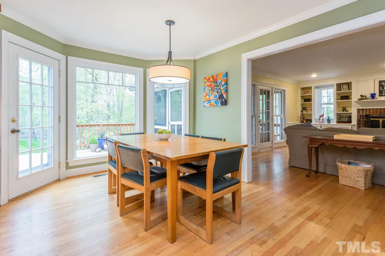 905 Brookfield Road Raleigh, NC 27615 - Photo 12 of 25 a view of a dining room with furniture window and wooden floor