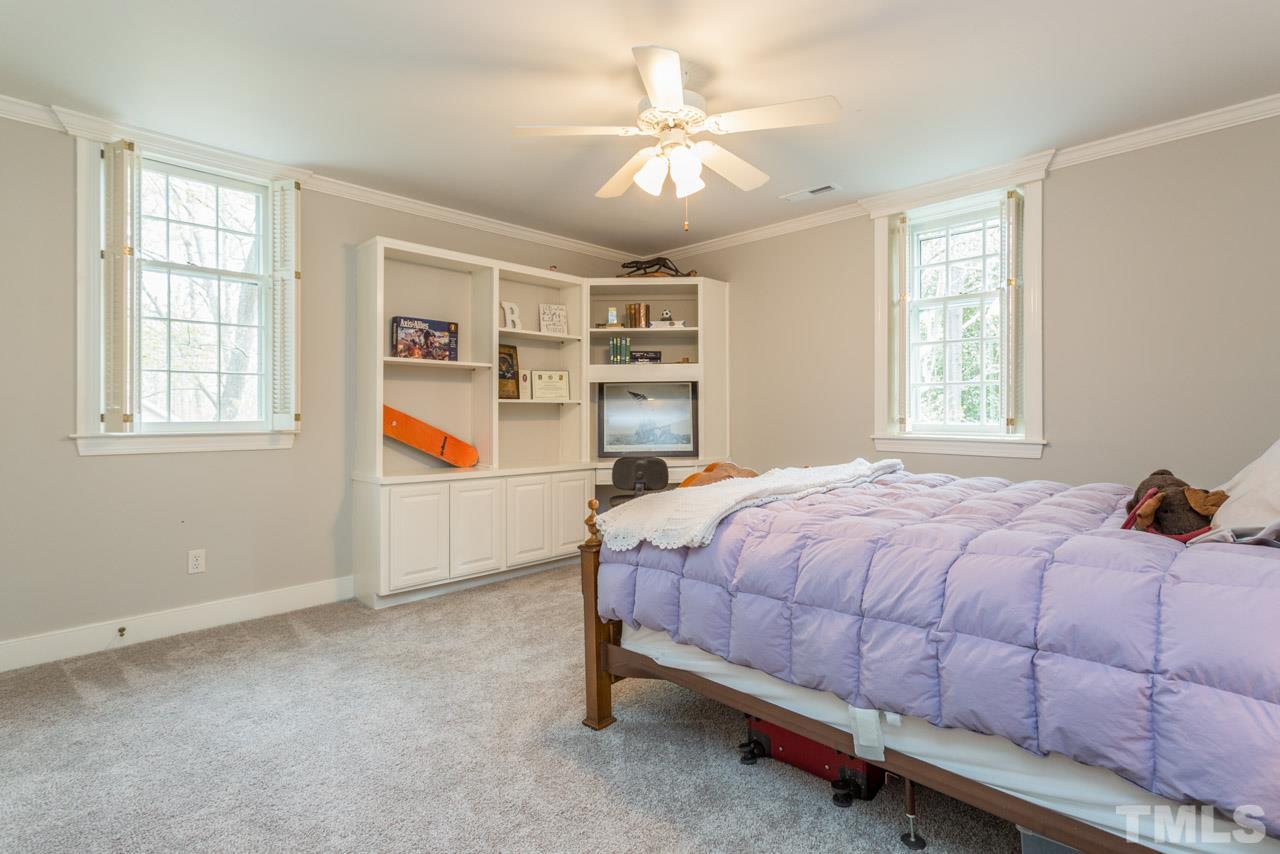 905 Brookfield Road Raleigh, NC 27615 - Photo 18 of 25 a bedroom with a bed and window