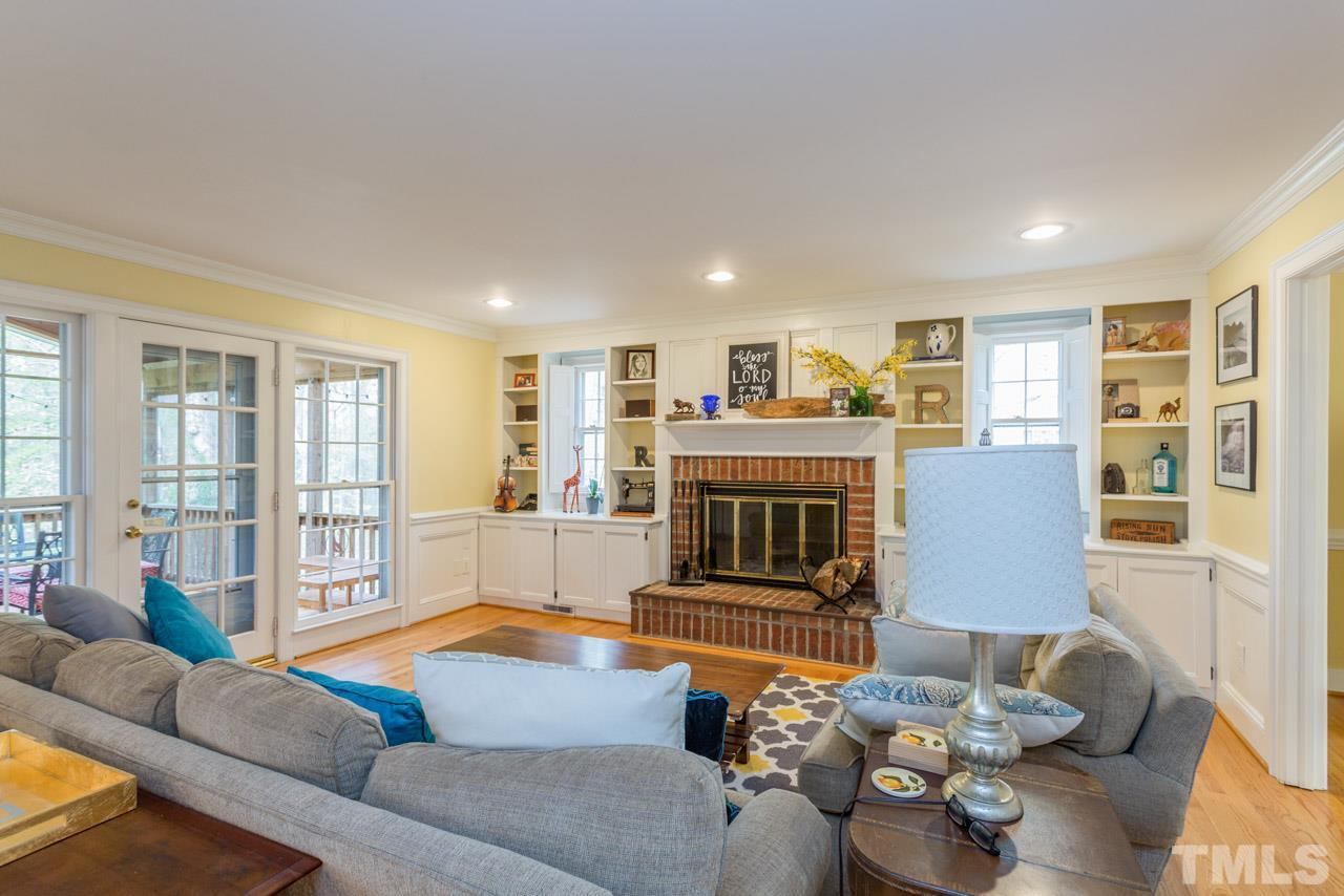 905 Brookfield Road Raleigh, NC 27615 - Photo 10 of 25 a living room with furniture and a fireplace