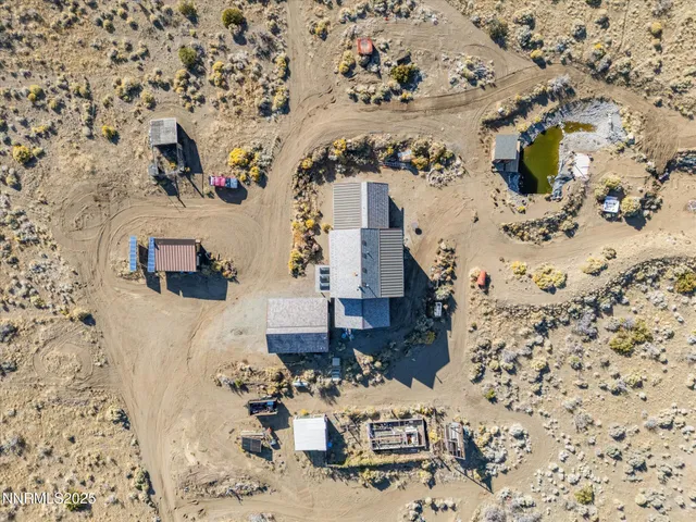 a aerial view of a house with a yard