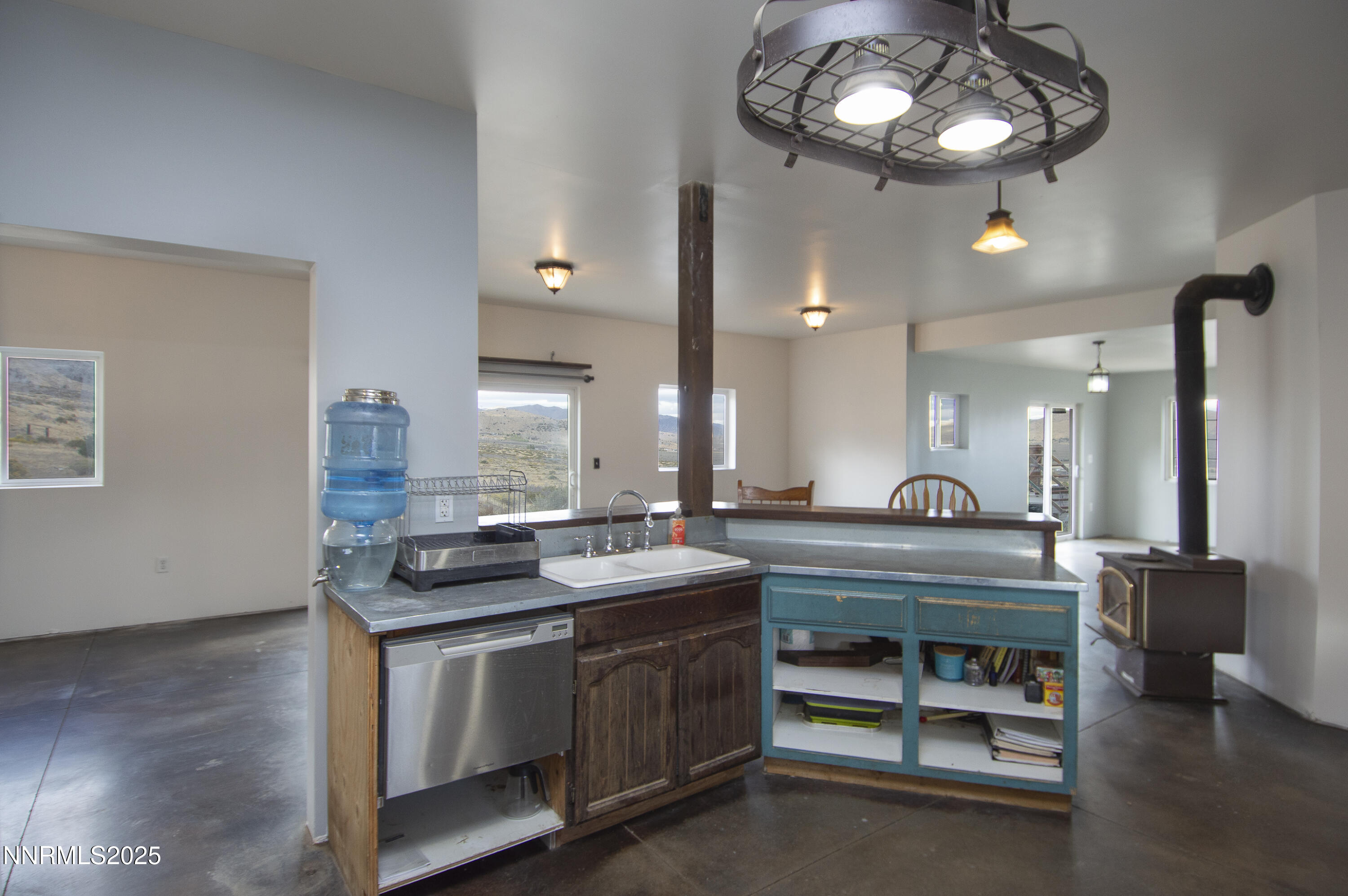 20 Prairie Way Reno, NV 89506 - Photo 30 of 48 a view of dining room and kitchen island with wooden floor