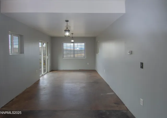 a room with a bed and a window