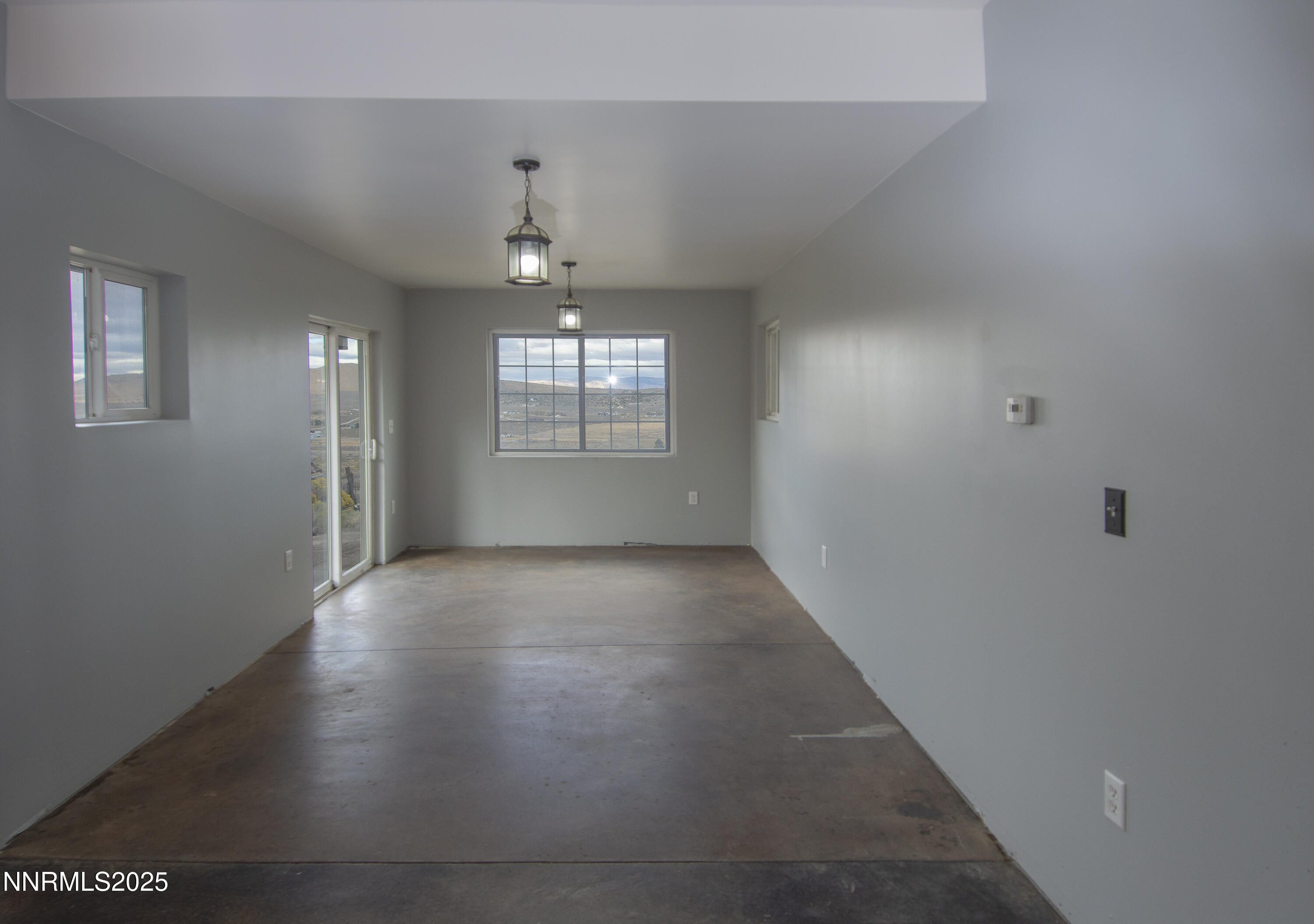 20 Prairie Way Reno, NV 89506 - Photo 34 of 48 an empty room with chandelier fan and windows