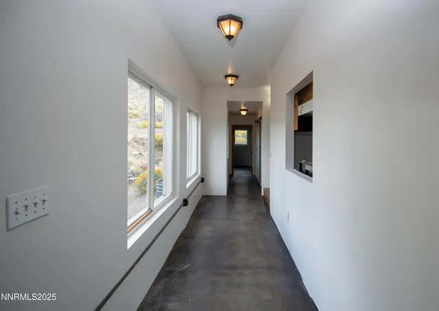 a bathroom with a toilet and a bathtub