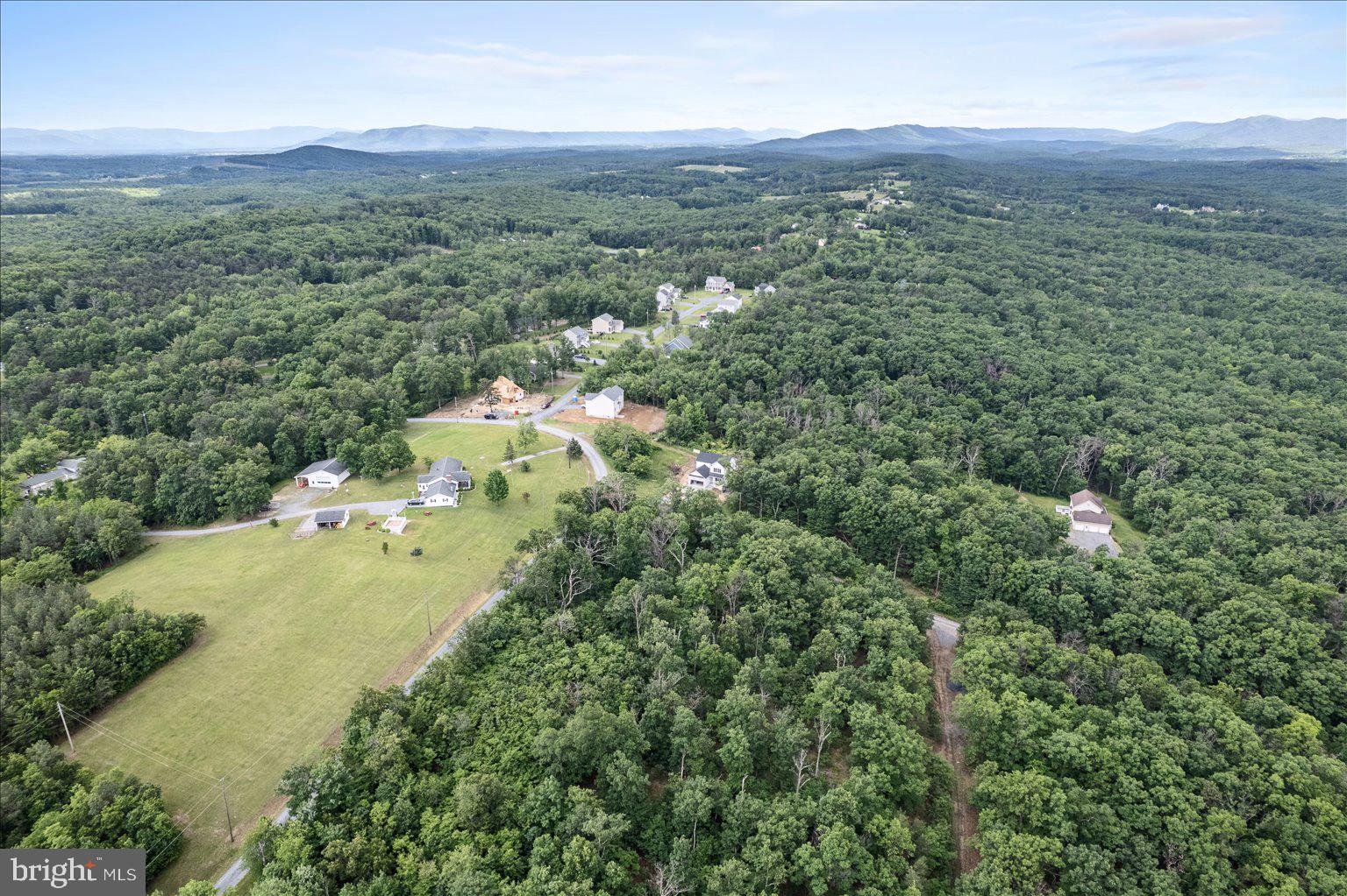 11-12 Glen Ridge Road Winchester, VA 22602 - Photo 2 of 11 a view of a lush green hillside and houses