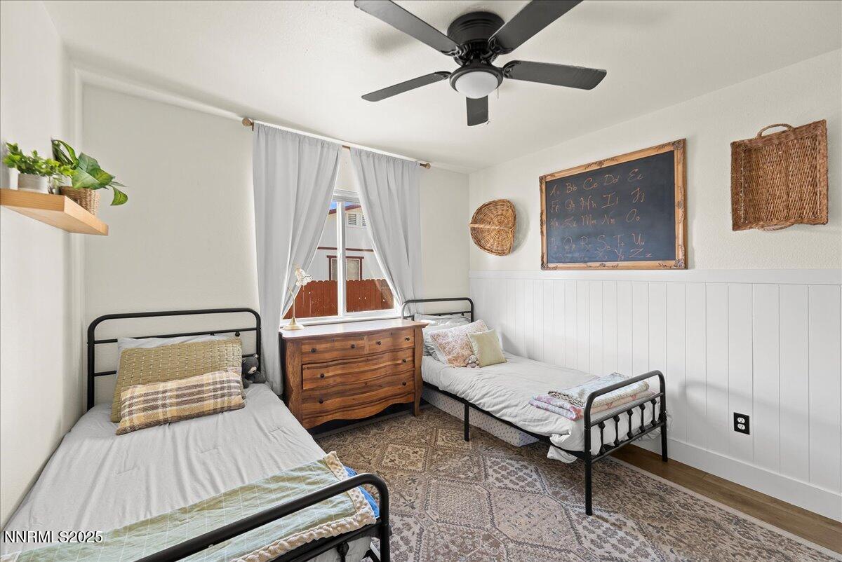 17675 Alexandria Court Reno, NV 89508 - Photo 14 of 31 a bedroom with a bed and a chandelier