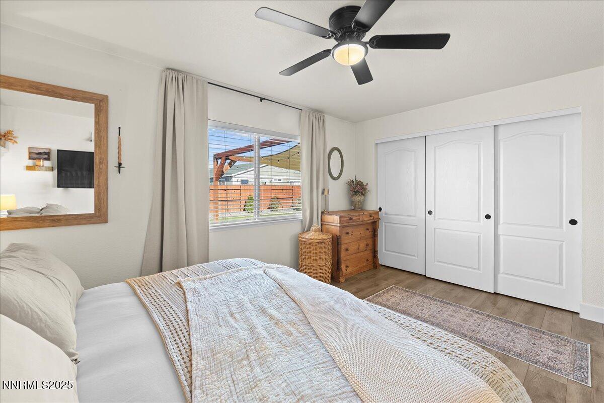 17675 Alexandria Court Reno, NV 89508 - Photo 17 of 31 a bedroom with a large bed and a window