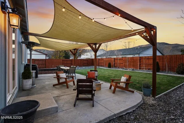a patio with table and chairs