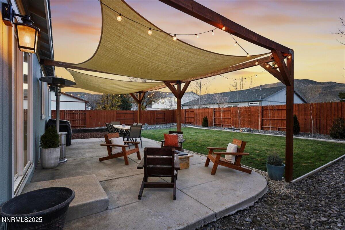 17675 Alexandria Court Reno, NV 89508 - Photo 20 of 31 a patio with table and chairs