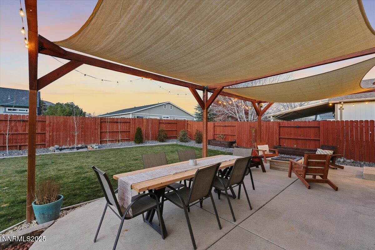 17675 Alexandria Court Reno, NV 89508 - Photo 22 of 31 a view of a patio with table and chairs and potted plants