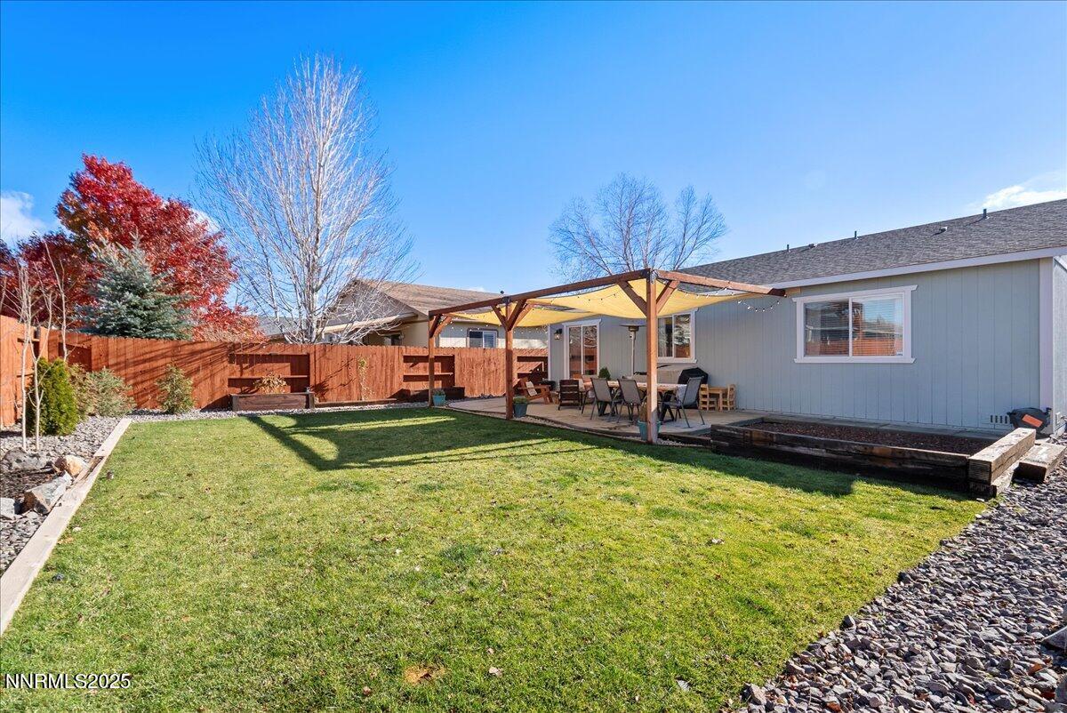 17675 Alexandria Court Reno, NV 89508 - Photo 30 of 31 a swimming pool with outdoor seating and yard
