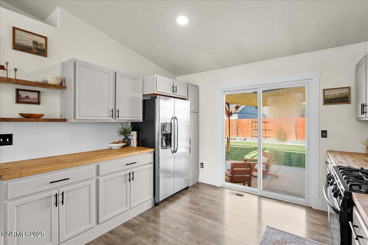 17675 Alexandria Court Reno, NV 89508 - Photo 9 of 31 a kitchen with stainless steel appliances a refrigerator sink and cabinets