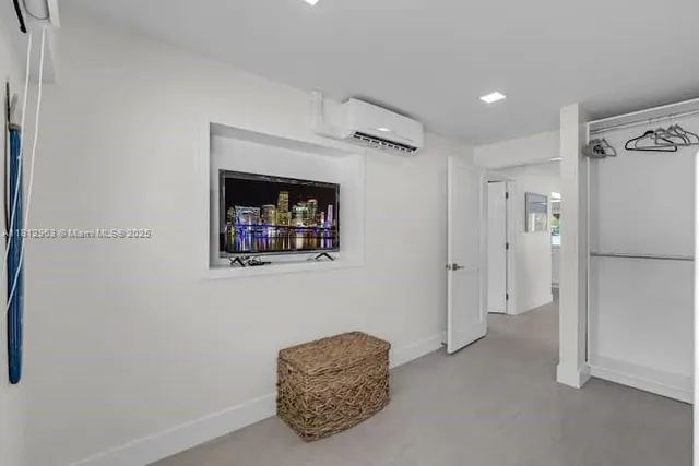a view of livingroom with furniture and a hallway