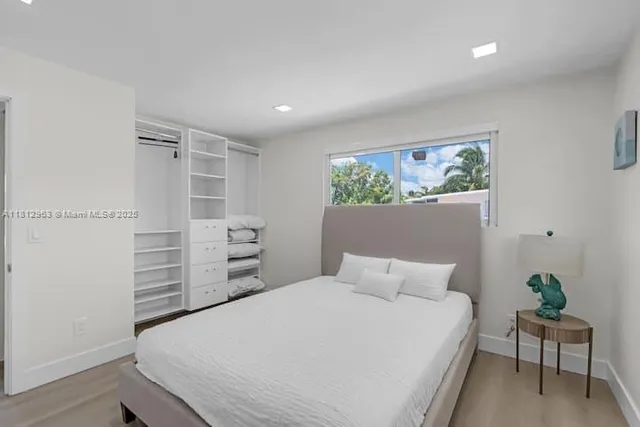 a bedroom with a bed and a view of bedroom