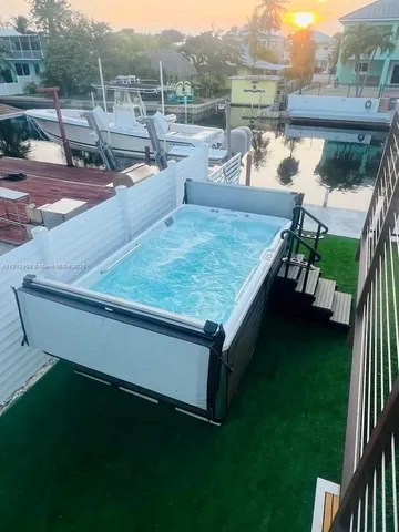 a view of a backyard with sitting area