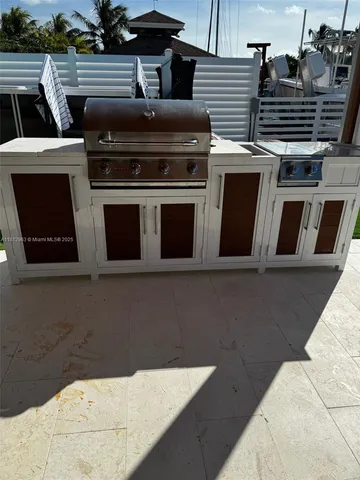 a stove top oven sitting inside of a kitchen
