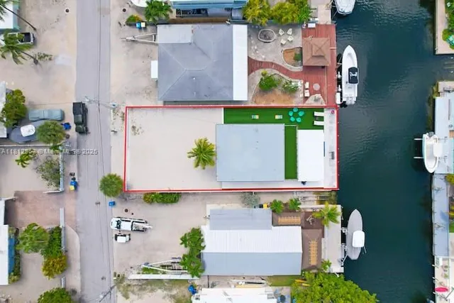 an aerial view of a house with outdoor space