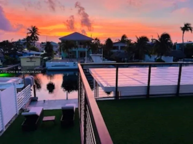 a view of swimming pool from a balcony