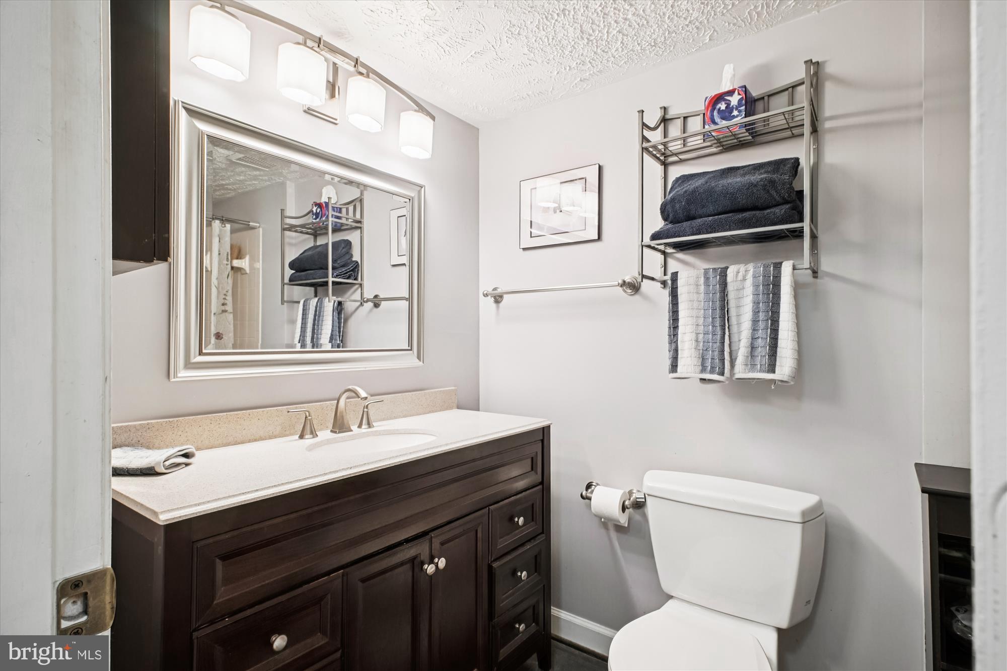 3801 Ridge Knoll Court, Unit 2A Fairfax, VA 22033 - Photo 15 of 37 a bathroom with a toilet sink and mirror