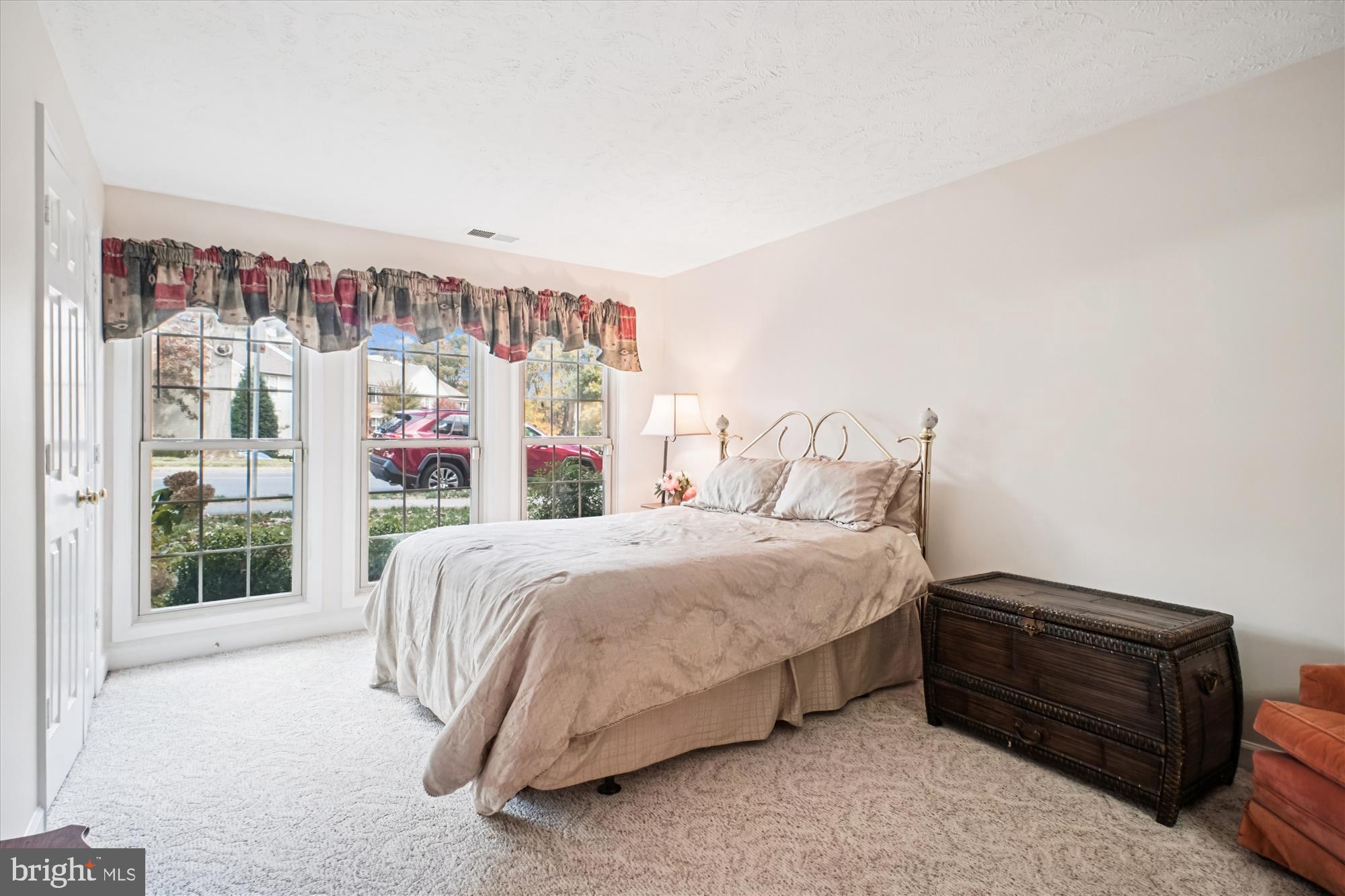 3801 Ridge Knoll Court, Unit 2A Fairfax, VA 22033 - Photo 17 of 37 a bed sitting in a bedroom next to a window