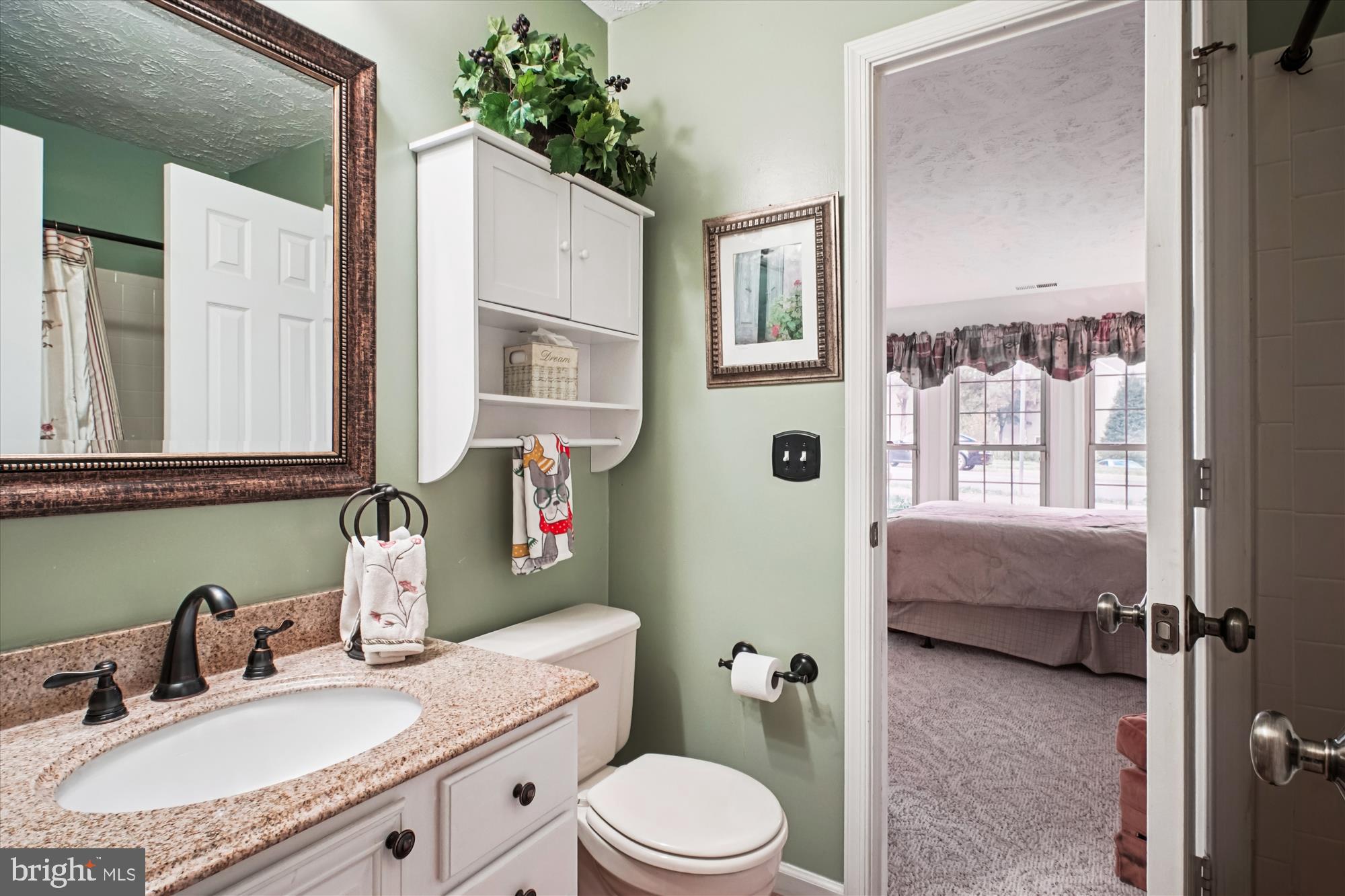 3801 Ridge Knoll Court, Unit 2A Fairfax, VA 22033 - Photo 18 of 37 a bathroom with a granite countertop sink mirror vanity and toilet