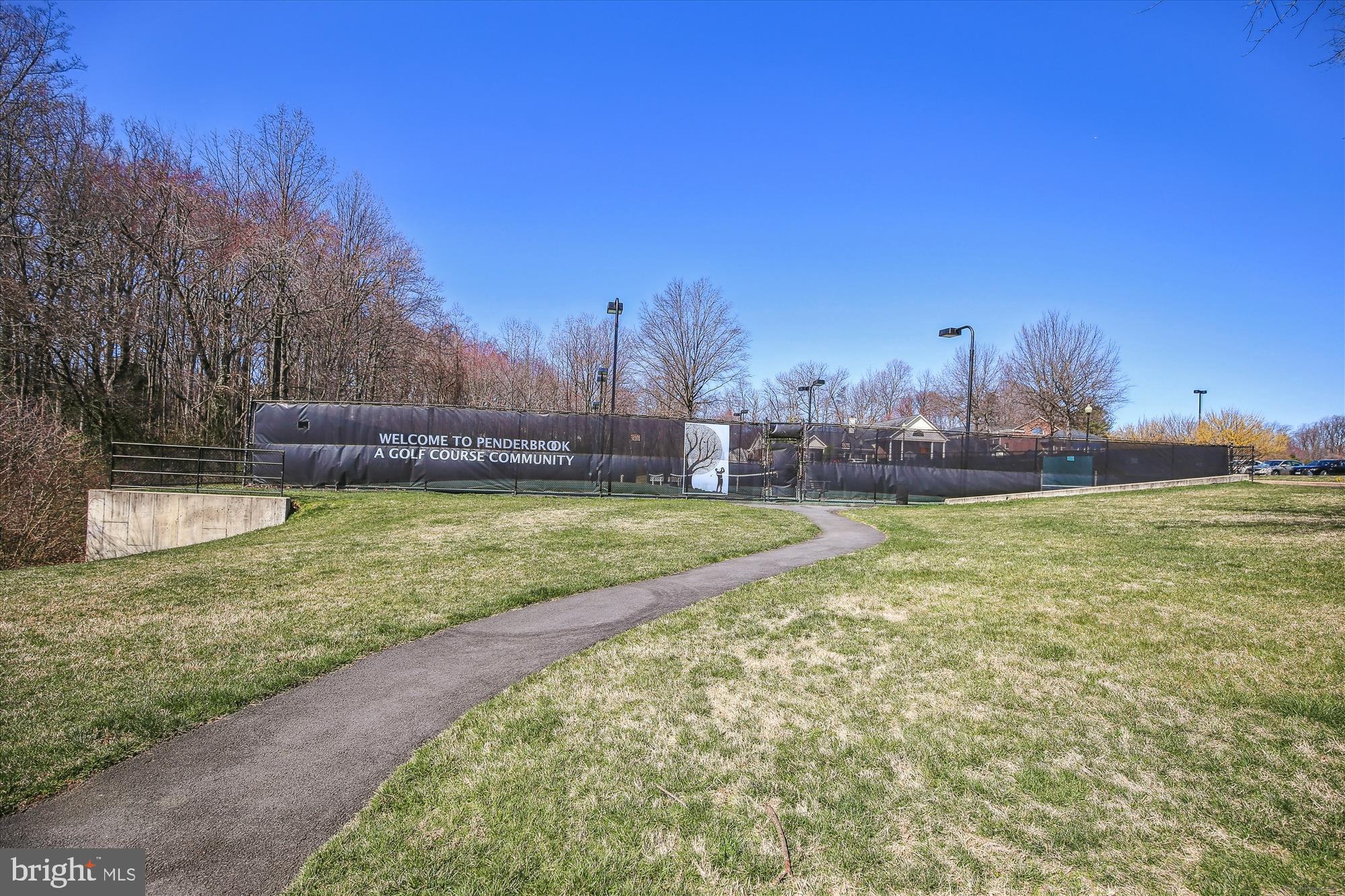 3801 Ridge Knoll Court, Unit 2A Fairfax, VA 22033 - Photo 28 of 37 a view of yard with swimming pool and trees in the background
