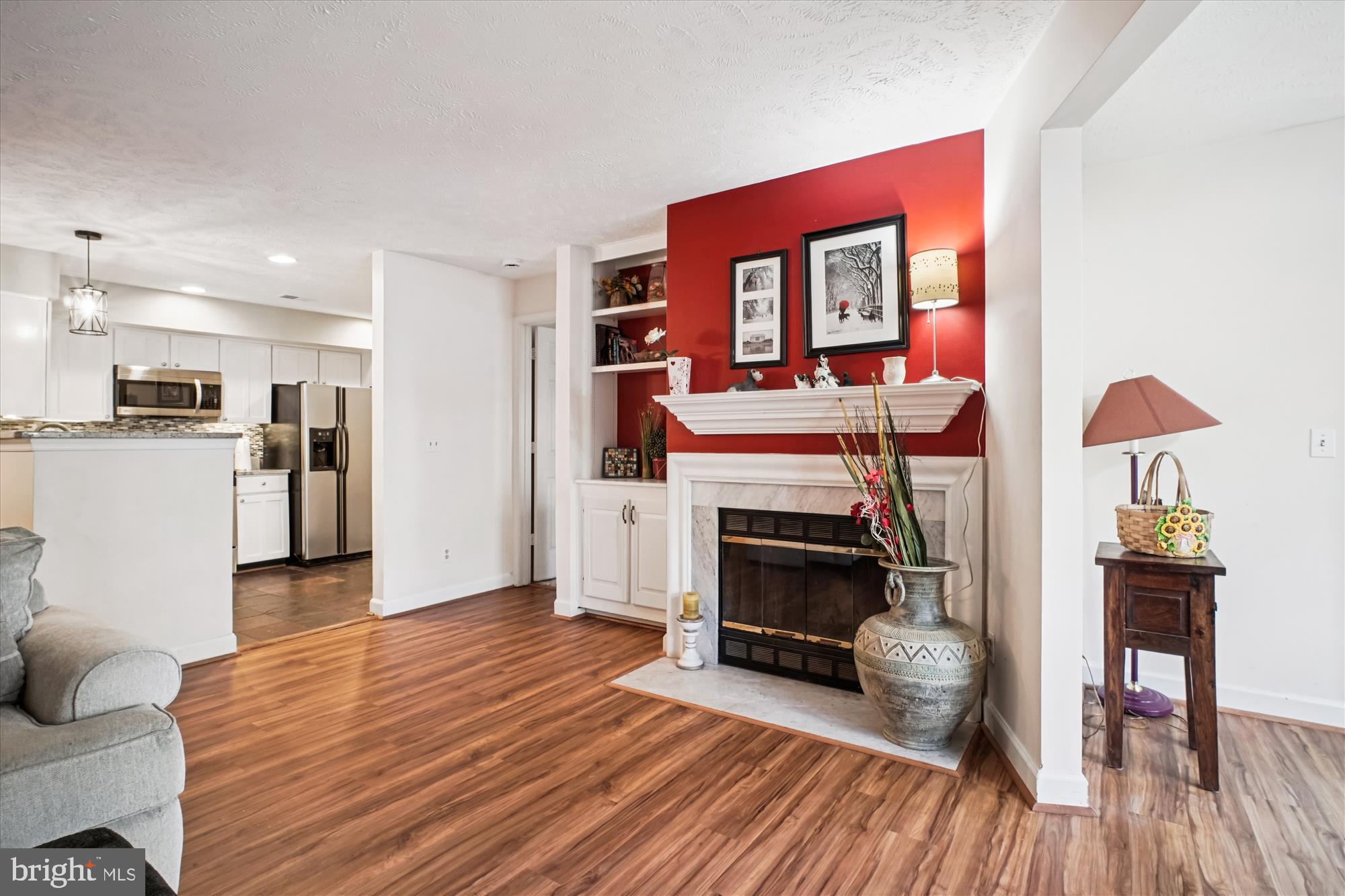 3801 Ridge Knoll Court, Unit 2A Fairfax, VA 22033 - Photo 36 of 37 a living room with furniture and a fireplace