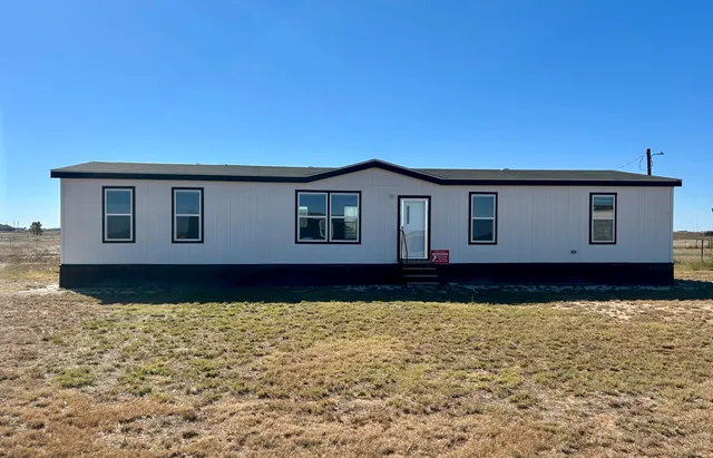 a house view with a garden space