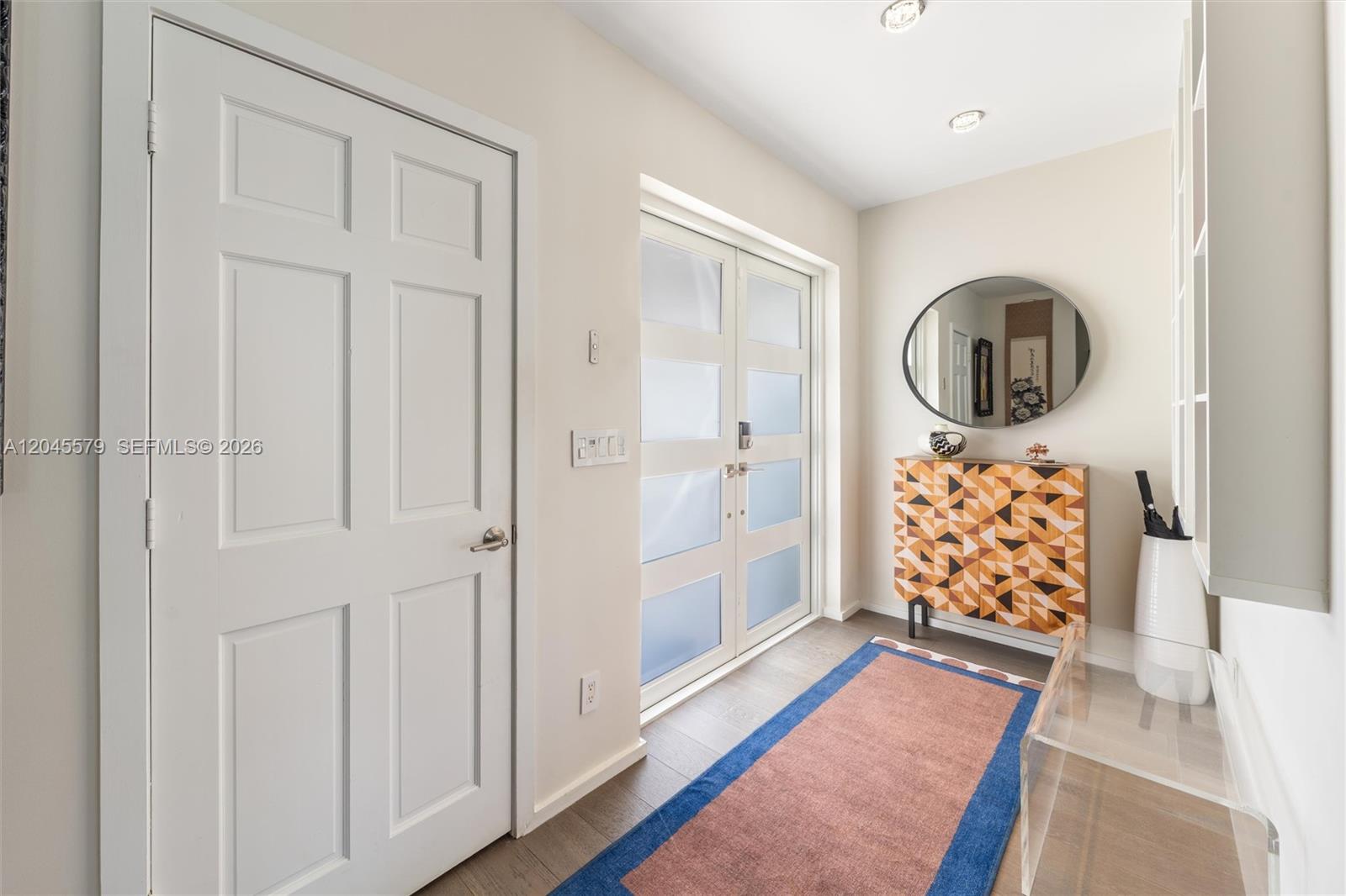 12944 Banyan Road North Miami, FL 33181 - Photo 3 of 26 a view of an entryway with wooden floor