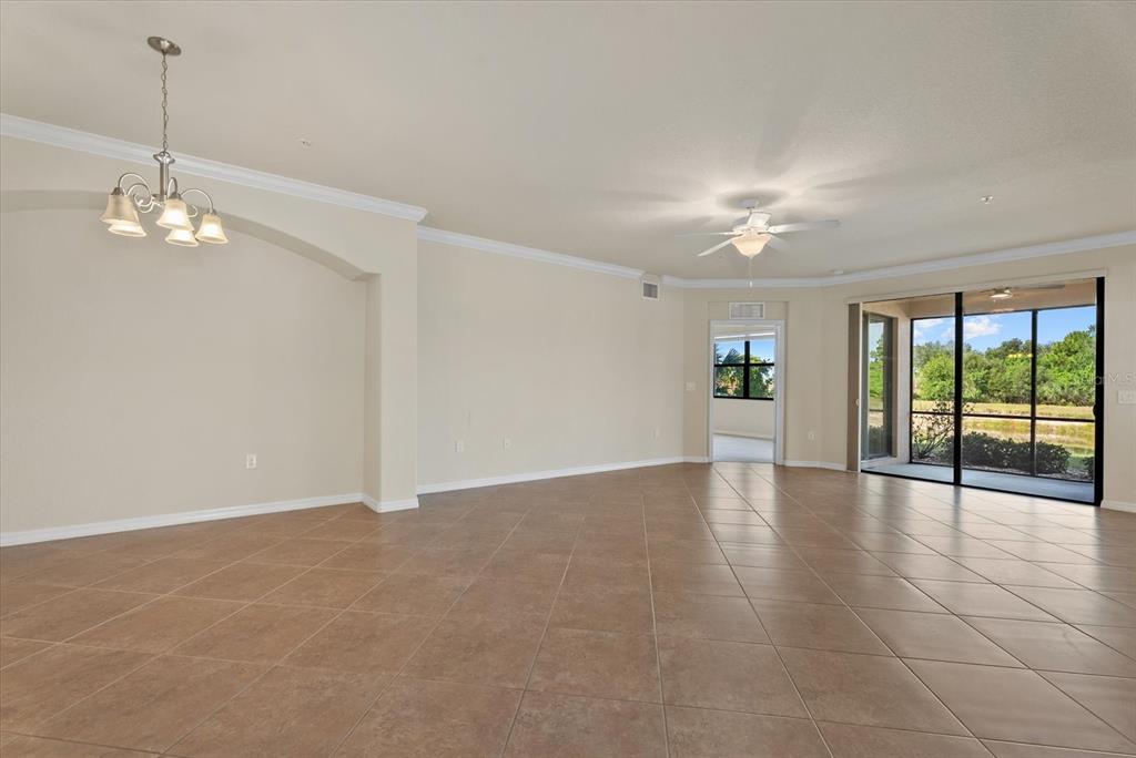 20080 Ragazza Circle, Unit 102 Venice, FL 34293 - Photo 13 of 49 a view of an empty room with a window