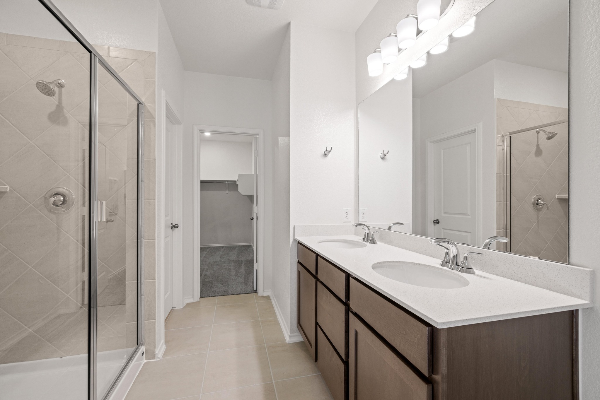 260 Feathers Street Jarrell, TX 76537 - Photo 17 of 34 a bathroom with a sink double vanity and a mirror