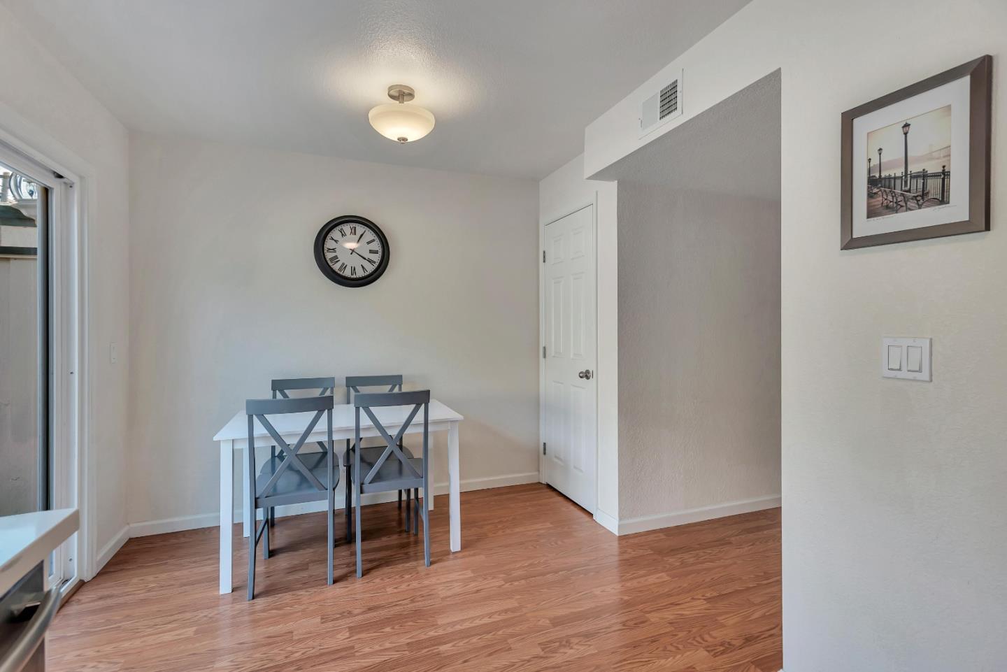 1377 Lerida Way Pacifica, CA 94044 - Photo 12 of 25 a view of a room with wooden floor and a window