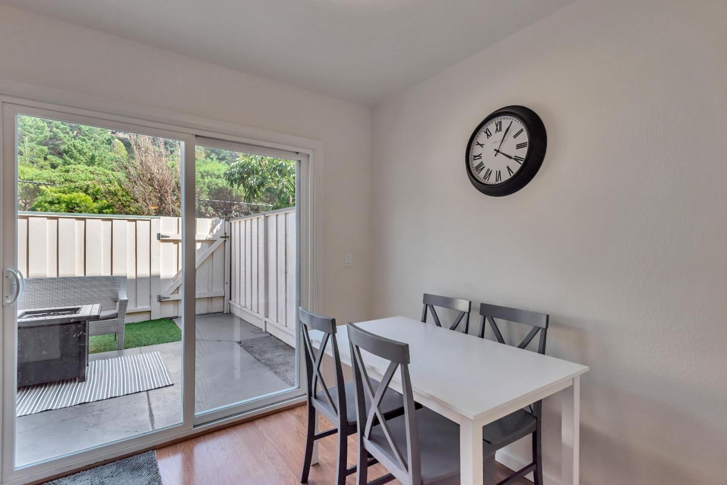 1377 Lerida Way Pacifica, CA 94044 - Photo 14 of 25 a view of a dining room with furniture and a large window