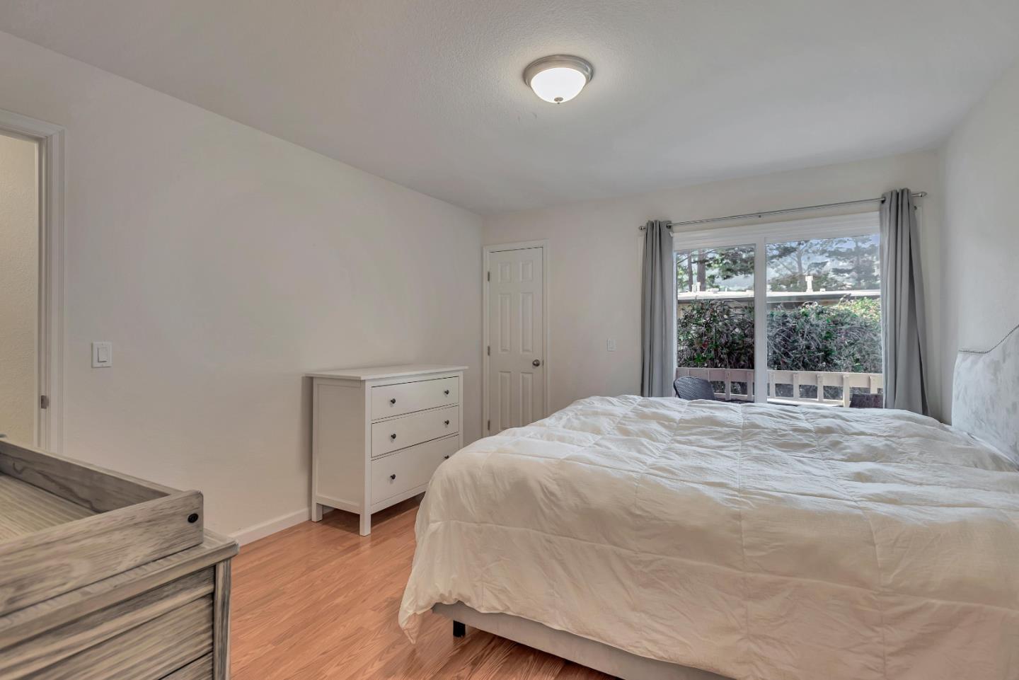 1377 Lerida Way Pacifica, CA 94044 - Photo 19 of 25 a bedroom with a bed and a window
