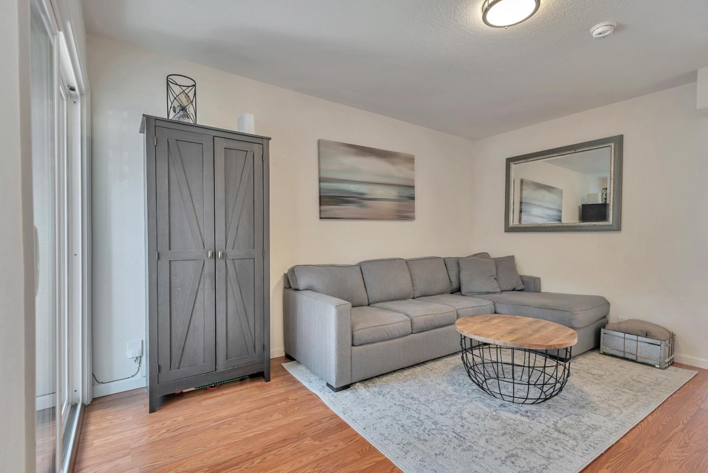 1377 Lerida Way Pacifica, CA 94044 - Photo 4 of 25 a living room with furniture and wooden floor
