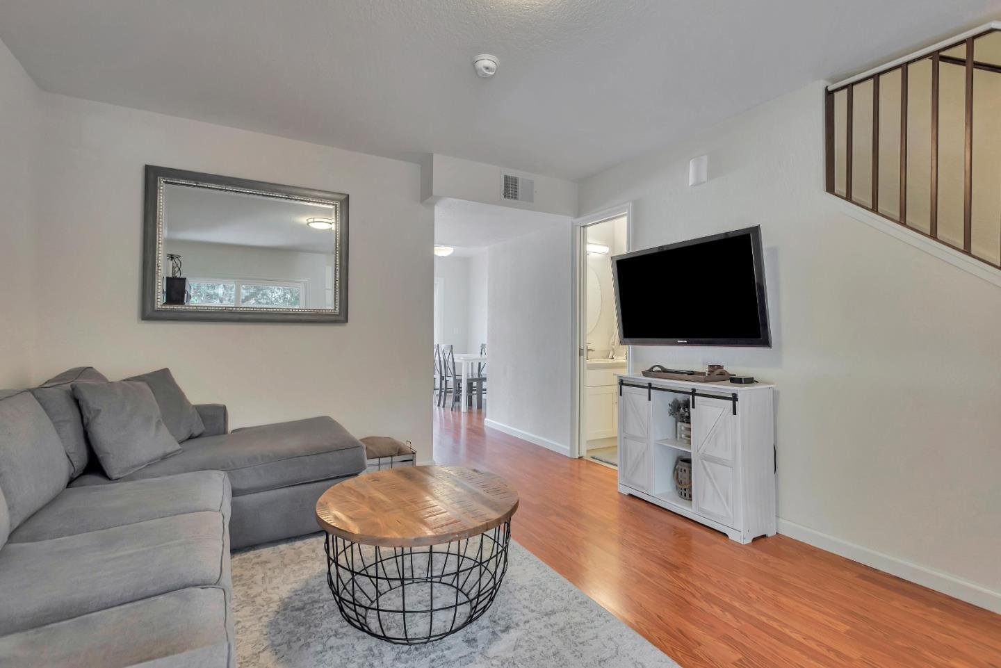 1377 Lerida Way Pacifica, CA 94044 - Photo 5 of 25 a living room with furniture and a flat screen tv