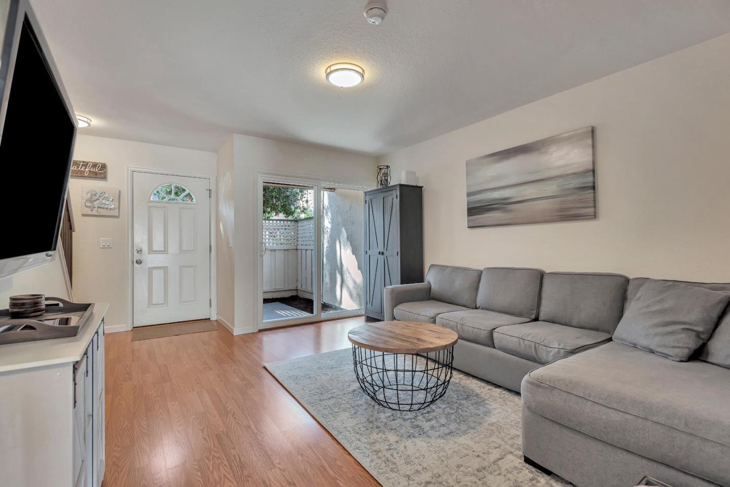 1377 Lerida Way Pacifica, CA 94044 - Photo 6 of 25 a living room with furniture and a flat screen tv