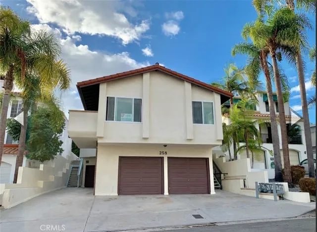 a front view of a house with a garage