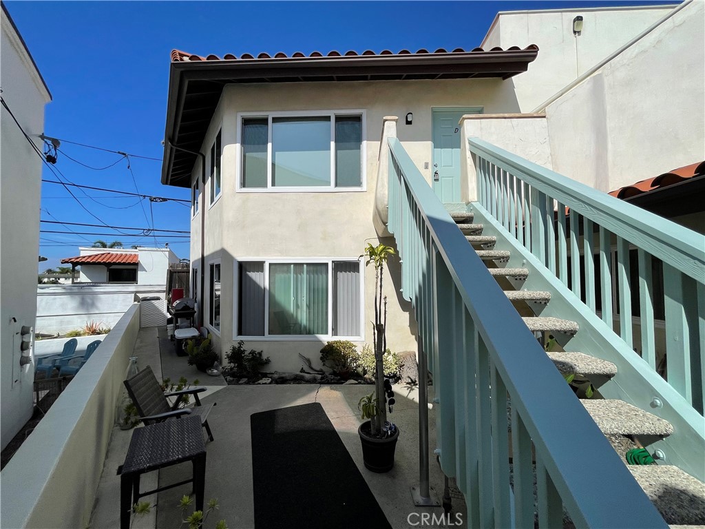 258 Avenida Victoria, Unit D San Clemente, CA 92672 - Photo 2 of 12 a view of a house with a patio
