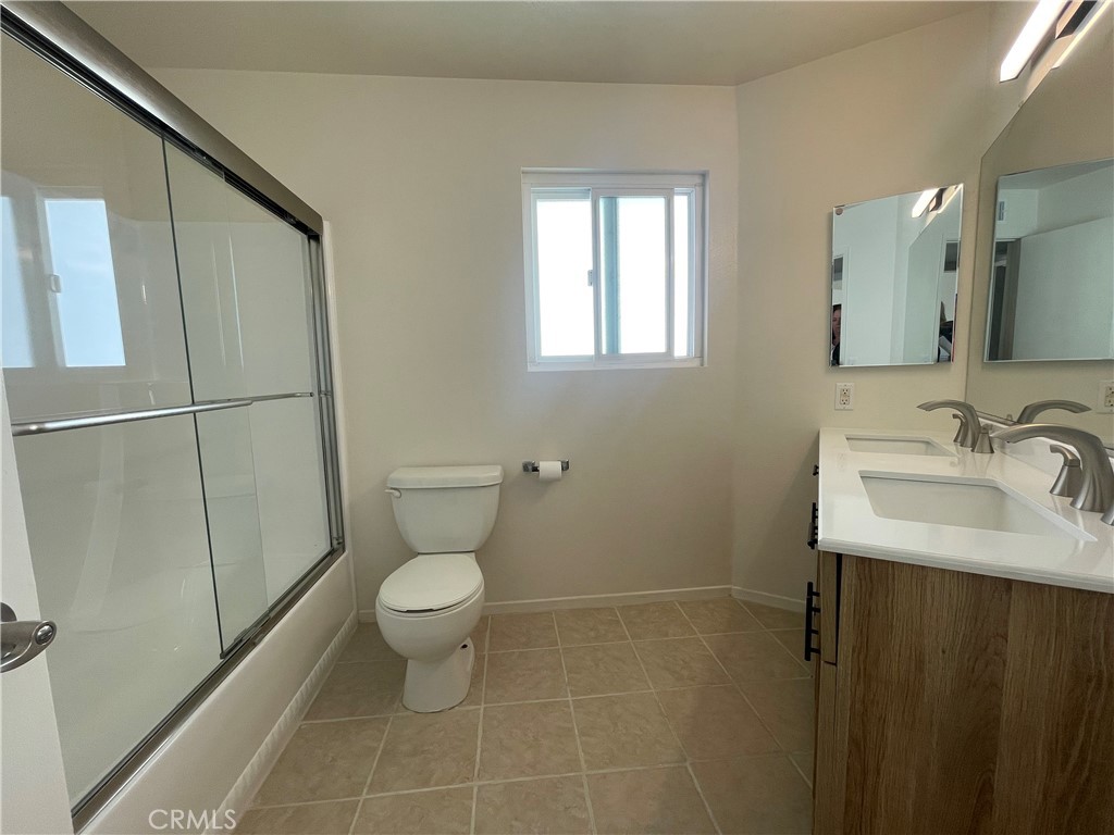 258 Avenida Victoria, Unit D San Clemente, CA 92672 - Photo 9 of 12 a bathroom with a sink toilet and a mirror