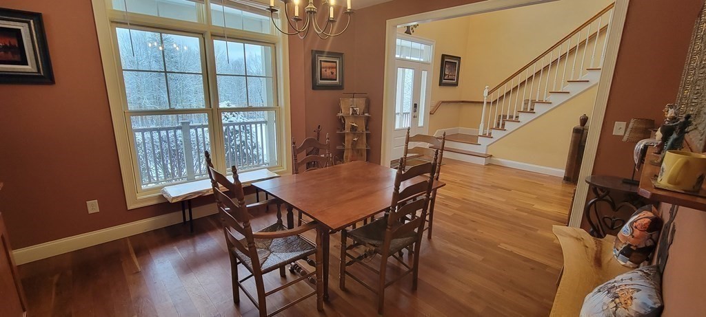 358 Rutherford Road Oakham, MA 01068 - Photo 13 of 42 a view of a dining room with furniture and a window