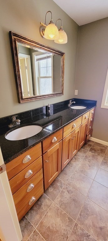 358 Rutherford Road Oakham, MA 01068 - Photo 22 of 42 a bathroom with a sink and a mirror