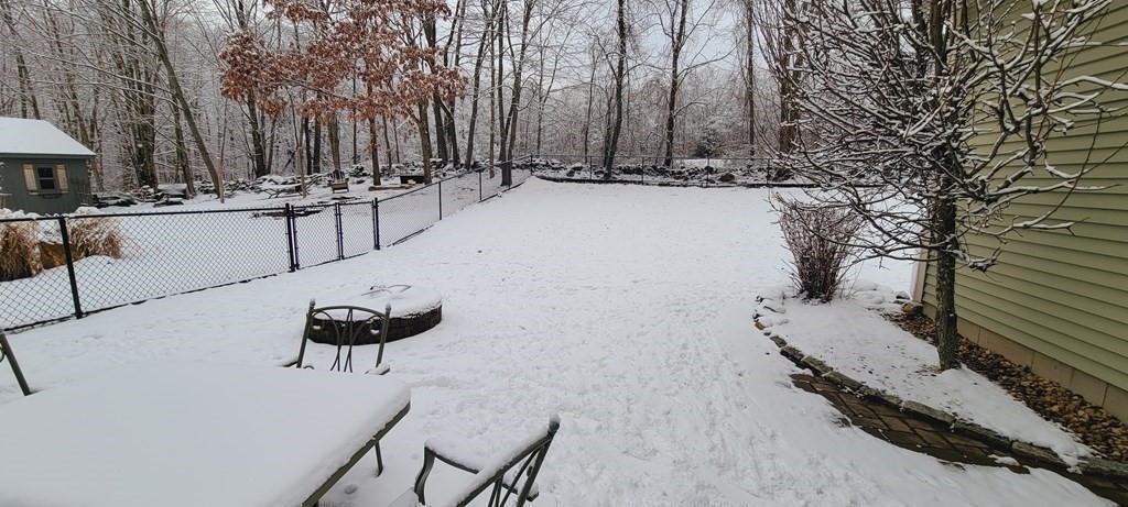 358 Rutherford Road Oakham, MA 01068 - Photo 25 of 42 a view of a backyard with chairs