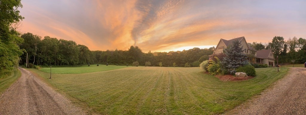 358 Rutherford Road Oakham, MA 01068 - Photo 4 of 42 a view of a big yard with a trampoline