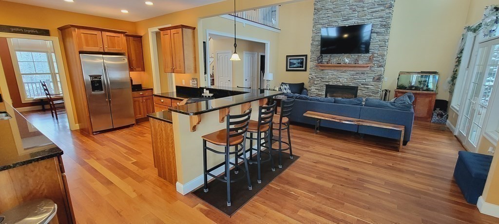 358 Rutherford Road Oakham, MA 01068 - Photo 7 of 42 a living room with furniture and a fireplace