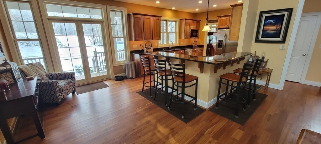 358 Rutherford Road Oakham, MA 01068 - Photo 8 of 42 a view of a dining room with furniture window and wooden floor