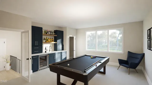 a living room with furniture a bookshelf and a window